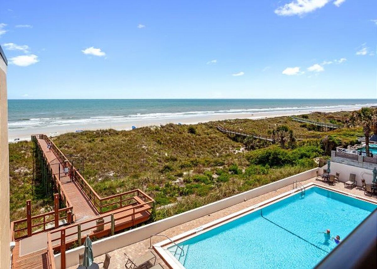 view of pool and beach from rental 407